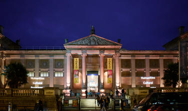 Photo of the front of the Ashmolean museum lit up at night