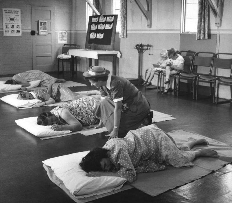 Black and white photograph of women preparing for labour in antenatal class
