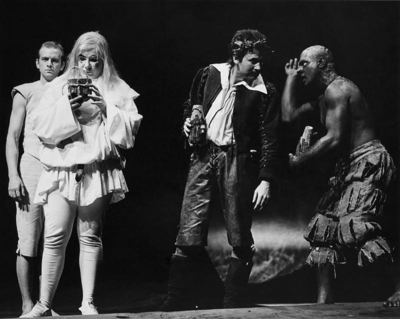 black and white image of 4 men in costume on stage polaying the Tempest