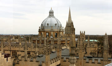 Photo of the dome of Radcliffe Camera surrounded by Oxford spires