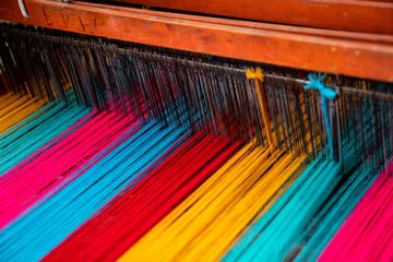 Loom with different coloured threads