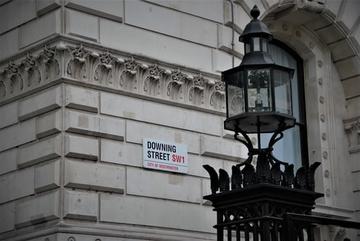 Image of Downing Street sign on brick building