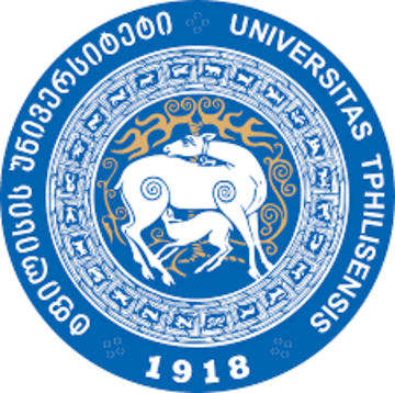 Ivane Javakhishvili Tbilisi State University circular blue logo depicting a white deer feeding its fawn. It is surrounded by an ornamental circle depicting other animals and this is surroudned by the university name in Latin and Georgian and Latin.