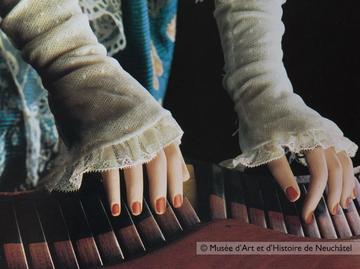 Close-up on the hands of The Musician automaton