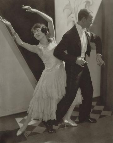 man and woman dancing in formal attire