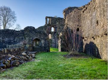 Image of the interior of the ruined Great Hall at Abergavenny Castle, looking west.