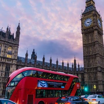 Image depicting a London bus in front of the parliament building and Elizabeth Tower (Big Ben)