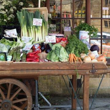Wooden cart filled with fresh vegetables