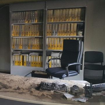 Charred chair and desk following arson attack
