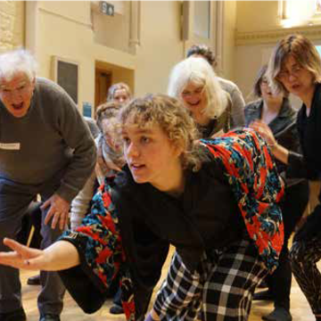 Image taken at workshop 'Moving together combating loneliness and enhancing connectivity through movement' showing dancers moving together.