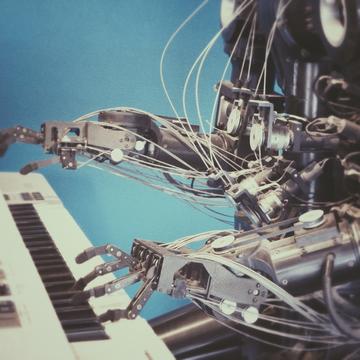Image of a robot playing the piano
