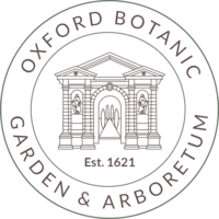 Circle logo with Oxford Botanic Garden and Arboretum text around the edges and a building illustration in the centre