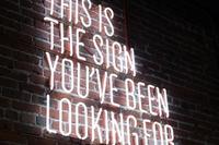 this is the sign by austin chan on unsplash