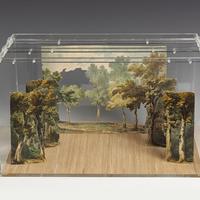 Image depicts a model of assembled stage screens of a tree landscape of Kensington Gardens.