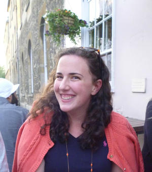 Alexis Gorby wearing a pink cardigan and blue dress