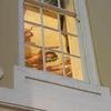 painting of greek scene seen through window panes