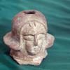 Head of terracotta figuring with short hair/hat