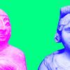 Two old statues re-coloured in bright pink and blue against a green backdrop