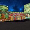A colourful illustration of a medieval village is projected onto the side of Oxford Castle